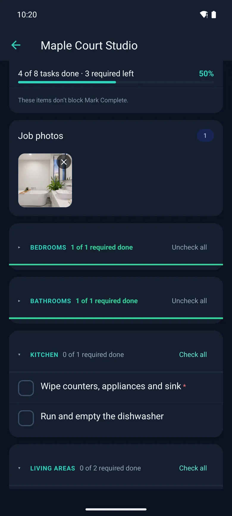 A job in the crew app: 4 of 8 tasks done, the bathroom photo attached, bedrooms and bathrooms done
