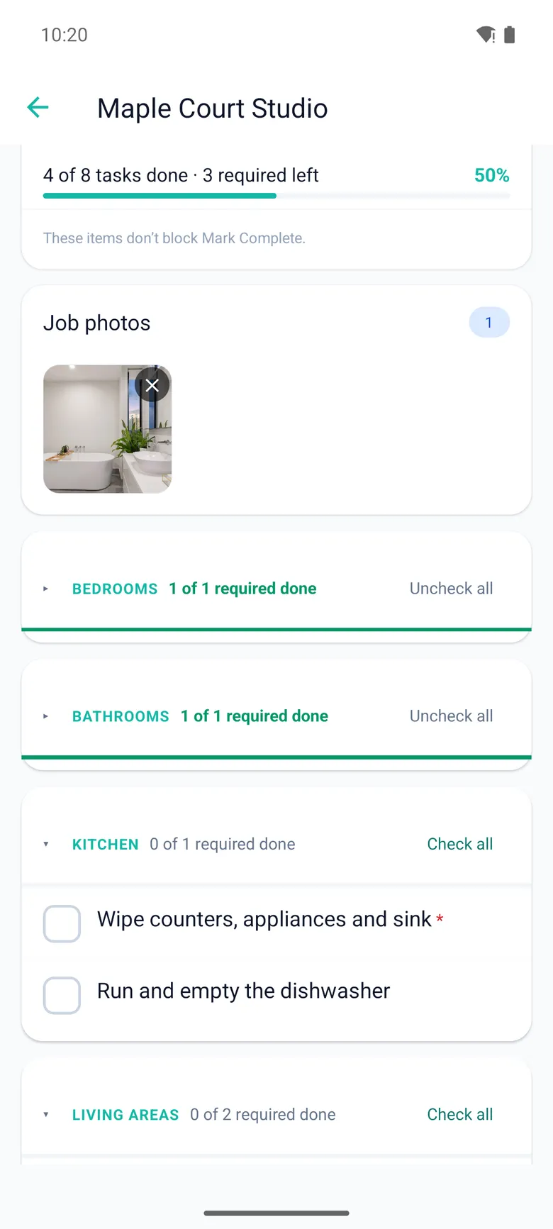 A job in the crew app: 4 of 8 tasks done, the bathroom photo attached, bedrooms and bathrooms done